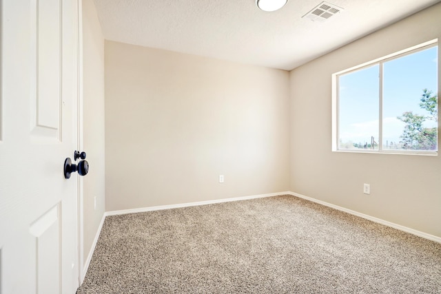 1004 11th St SE, Rio Rancho, NM 87124 - spare room featuring carpet and healthy amount of natural light