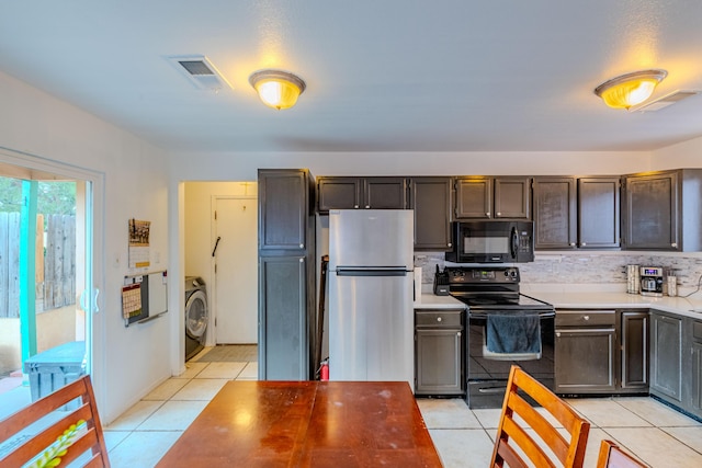 1397 Lil Ave NE, Rio Rancho, NM 87144 - kitchen with black appliances, washer / clothes dryer, light tile patterned flooring, light countertops, and backsplash