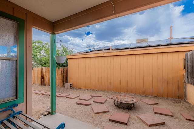 1397 Lil Ave NE, Rio Rancho, NM 87144 - fenced backyard with an outdoor fire pit