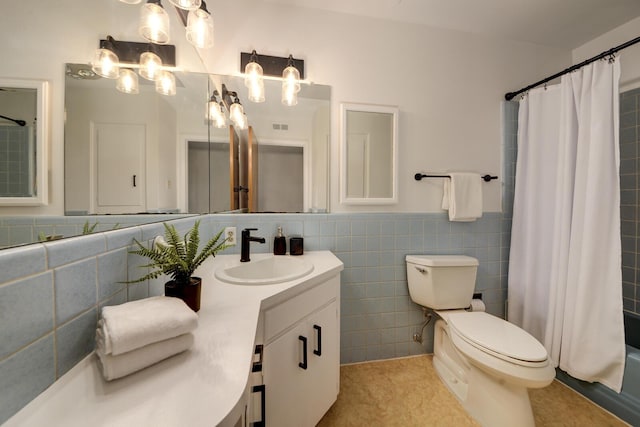 1733 Luthy Dr NE, Albuquerque, NM 87112 - full bathroom featuring tile walls, vanity, shower / bath combo with shower curtain, a wainscoted wall, and a chandelier