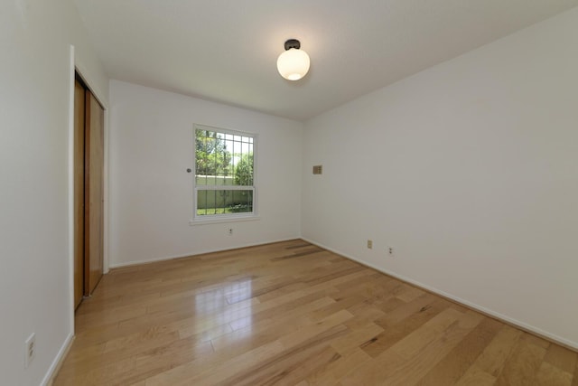 1733 Luthy Dr NE, Albuquerque, NM 87112 - unfurnished bedroom featuring light wood-style flooring and a closet