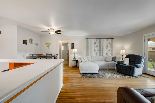 3921 Hilton Ave NE, Albuquerque, NM 87110 - living area with light wood finished floors and ceiling fan