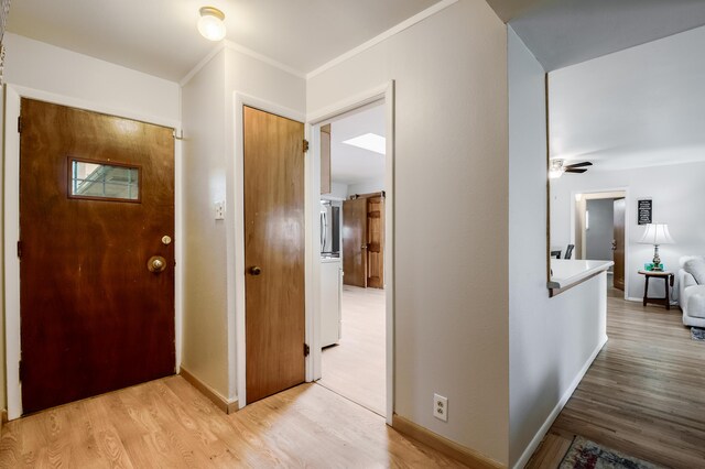 3921 Hilton Ave NE, Albuquerque, NM 87110 - foyer entrance with light wood-style flooring and ornamental molding