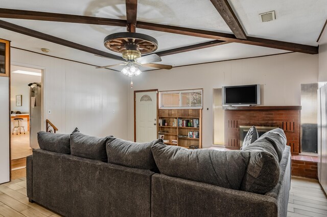 3921 Hilton Ave NE, Albuquerque, NM 87110 - living room with a ceiling fan, light wood-type flooring, and beamed ceiling