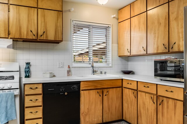 3921 Hilton Ave NE, Albuquerque, NM 87110 - kitchen with dishwasher, white range with gas cooktop, exhaust hood, and light countertops