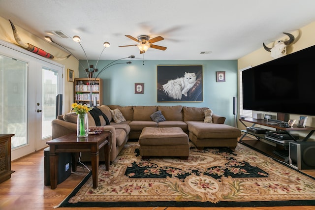 1897 Raspberry Ct NE, Rio Rancho, NM 87144 - living room featuring french doors, ceiling fan, and wood finished floors
