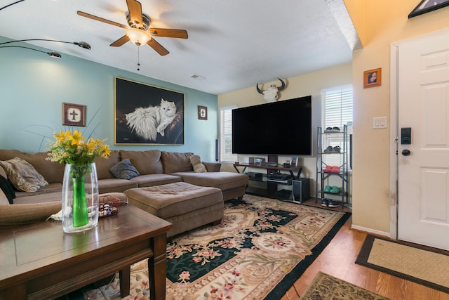 1897 Raspberry Ct NE, Rio Rancho, NM 87144 - living area with a ceiling fan and wood finished floors