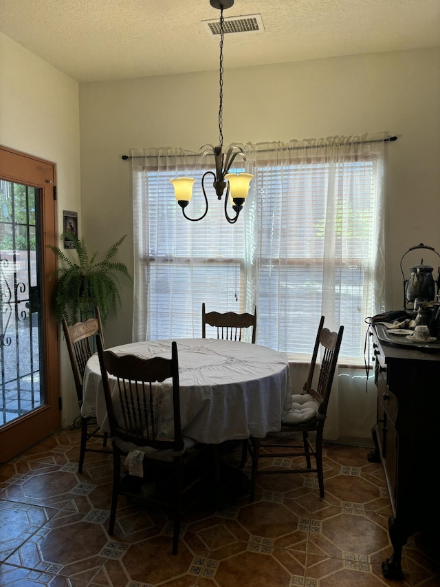 9523 Akutan Ct NW, Albuquerque, NM 87120 - dining area with a chandelier