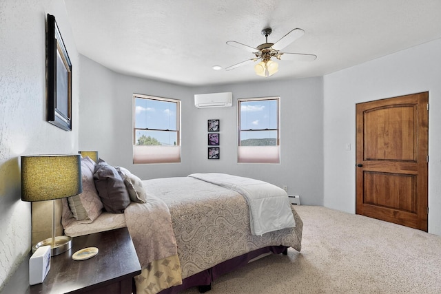 10 Francisco Rd, Cedar Crest, NM 87008 - bedroom featuring a wall mounted air conditioner, carpet floors, baseboard heating, and ceiling fan