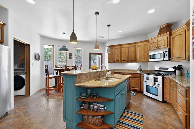 10 Francisco Rd, Cedar Crest, NM 87008 - kitchen with appliances with stainless steel finishes, washer / dryer, open shelves, recessed lighting, and pendant lighting