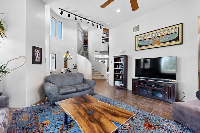 10 Francisco Rd, Cedar Crest, NM 87008 - living area with a ceiling fan, stairway, a high ceiling, track lighting, and tile patterned flooring