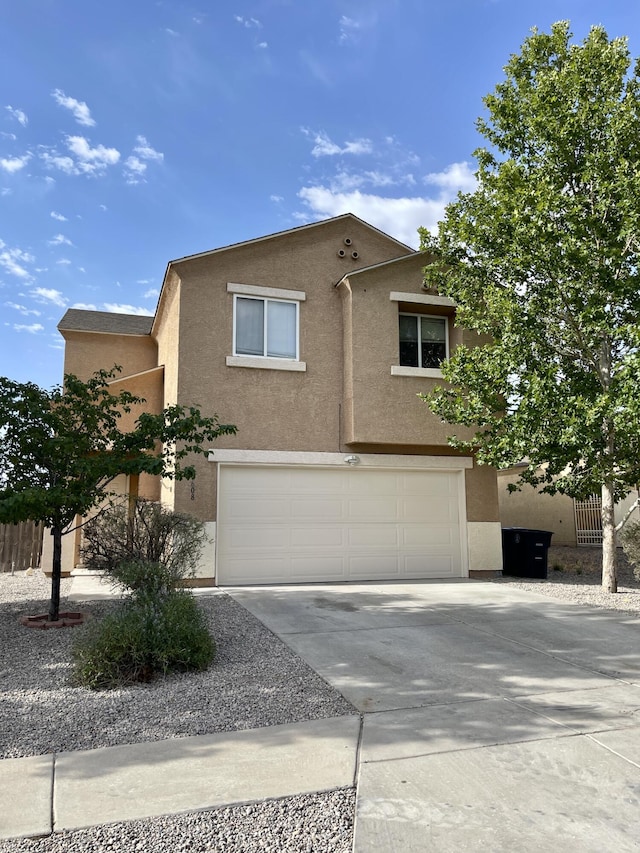 10608 Buck Island Rd SW, Albuquerque, NM 87121 - multi unit property with driveway, stucco siding, and an attached garage