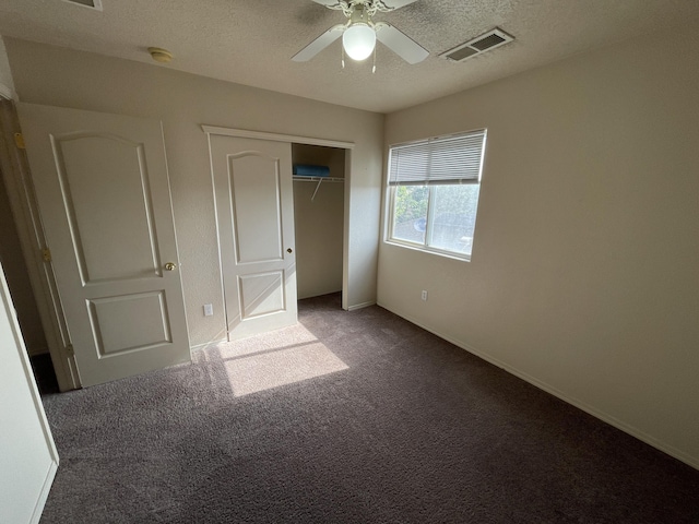 10608 Buck Island Rd SW, Albuquerque, NM 87121 - unfurnished bedroom featuring carpet flooring, a textured ceiling, a closet, and ceiling fan