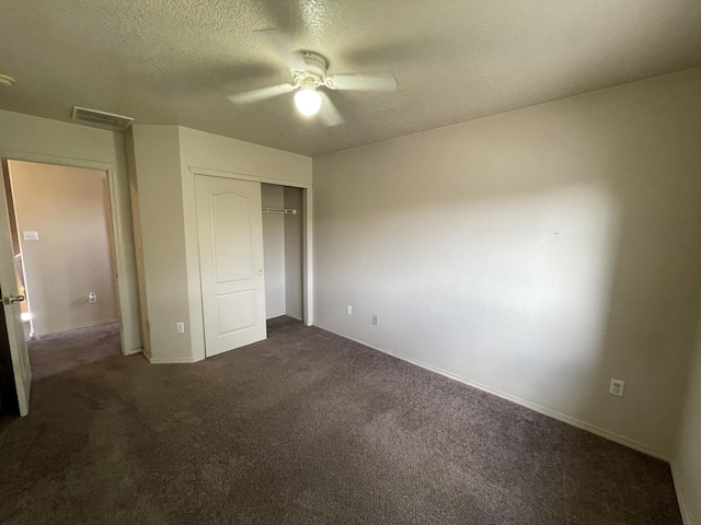 10608 Buck Island Rd SW, Albuquerque, NM 87121 - unfurnished bedroom featuring dark colored carpet, a closet, ceiling fan, and a textured ceiling