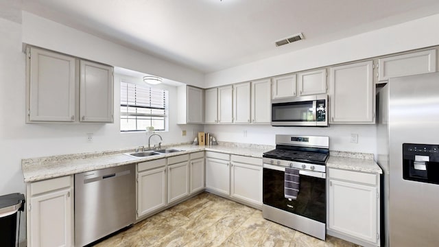 803 Western Hills Dr SE, Rio Rancho, NM 87124 - kitchen with appliances with stainless steel finishes and light countertops