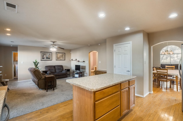 4840 Mcnary Ct NW, Albuquerque, NM 87120 - kitchen featuring arched walkways, ceiling fan, light wood-type flooring, light countertops, and recessed lighting