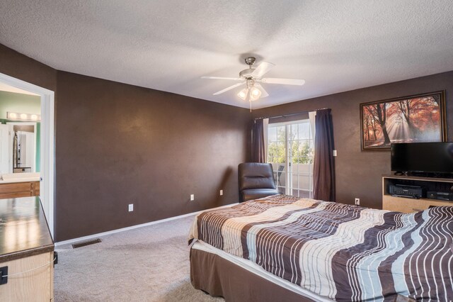 4840 Mcnary Ct NW, Albuquerque, NM 87120 - carpeted bedroom with a textured ceiling, ceiling fan, and ensuite bathroom