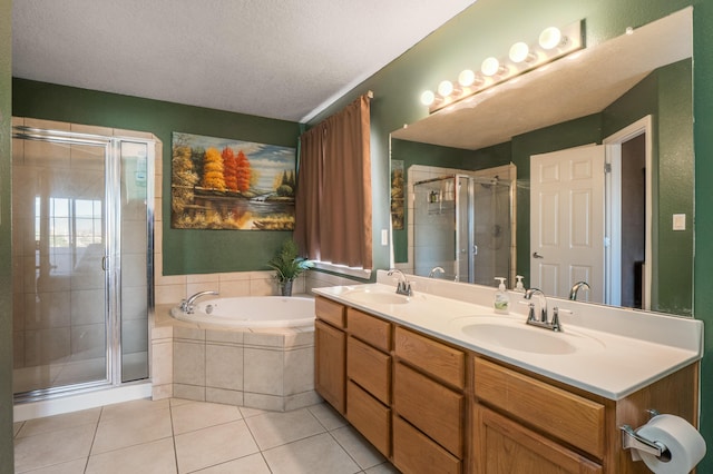 4840 Mcnary Ct NW, Albuquerque, NM 87120 - full bath with tile patterned flooring, a bath, a stall shower, double vanity, and a textured ceiling