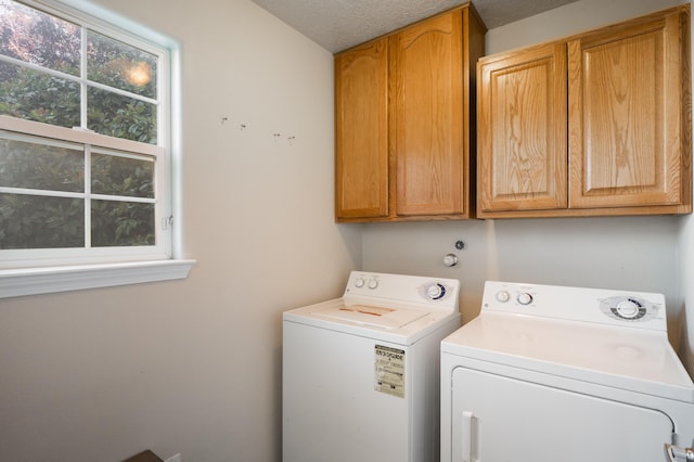 4840 Mcnary Ct NW, Albuquerque, NM 87120 - laundry room with cabinet space, washing machine and dryer, and a textured ceiling