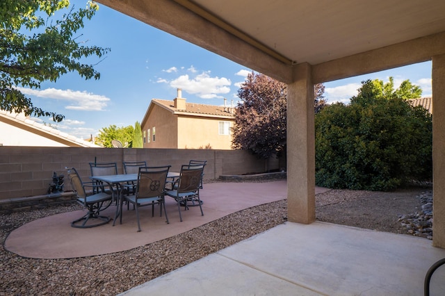 4840 Mcnary Ct NW, Albuquerque, NM 87120 - fenced backyard with a patio and outdoor dining area