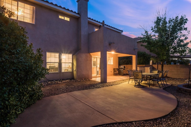 4840 Mcnary Ct NW, Albuquerque, NM 87120 - patio terrace at dusk with a patio area