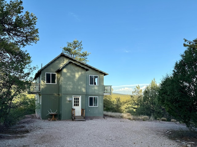 162 Black Bear Rd, Ramah, NM 87321 - back of house with a balcony and entry steps