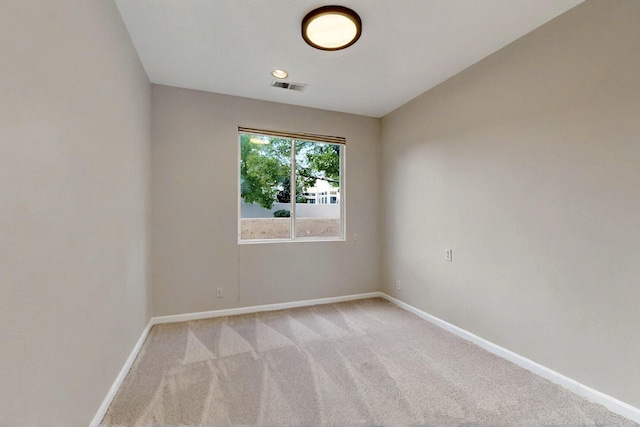 5 Woodflower Pl, Santa Fe, NM 87508 - unfurnished room featuring baseboards and light carpet