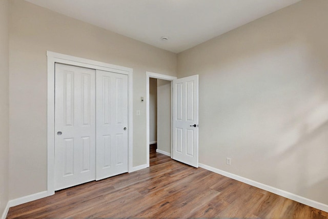 5 Woodflower Pl, Santa Fe, NM 87508 - unfurnished bedroom featuring wood finished floors and a closet
