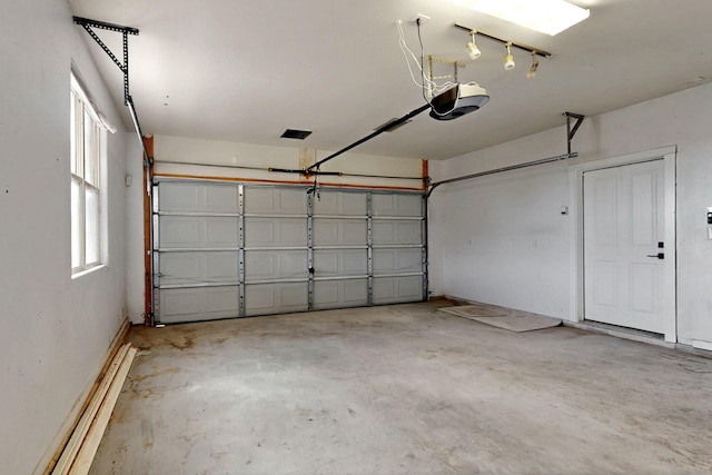 5 Woodflower Pl, Santa Fe, NM 87508 - garage featuring a garage door opener
