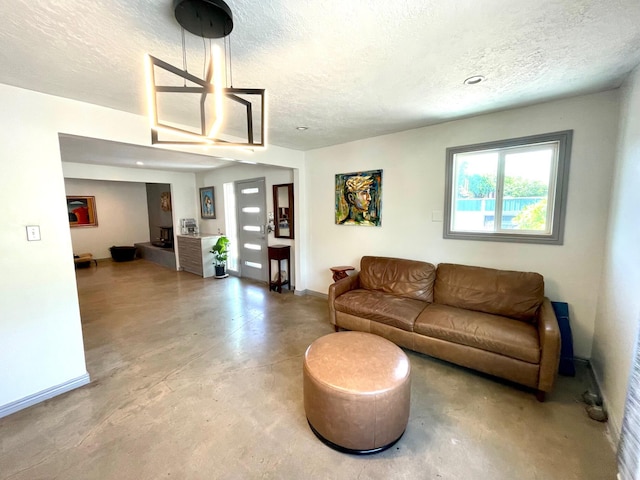 201 Marlowe Ln, Albuquerque, NM 87113 - living room featuring concrete floors and a textured ceiling
