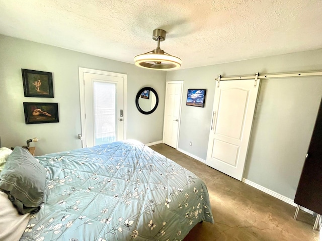 201 Marlowe Ln, Albuquerque, NM 87113 - carpeted bedroom featuring a barn door and a textured ceiling