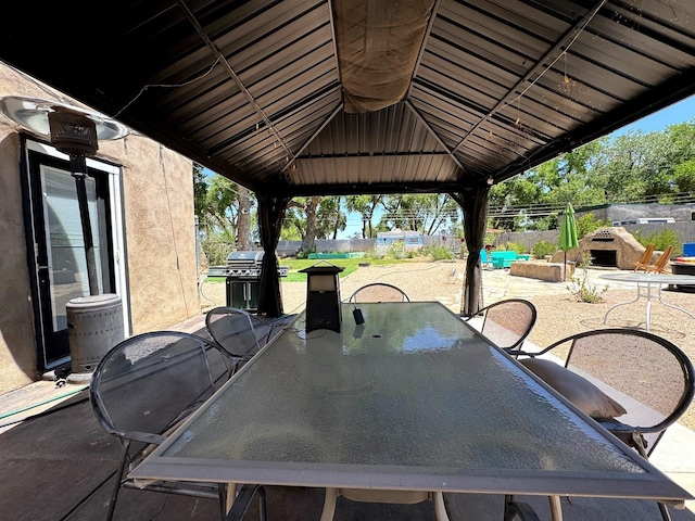 201 Marlowe Ln, Albuquerque, NM 87113 - view of patio featuring a gazebo, outdoor dining space, and grilling area