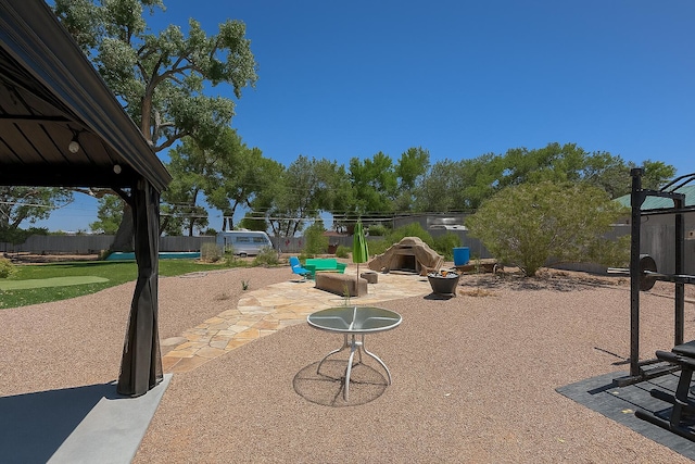 201 Marlowe Ln, Albuquerque, NM 87113 - view of play area featuring a patio, a fenced backyard, and a putting green