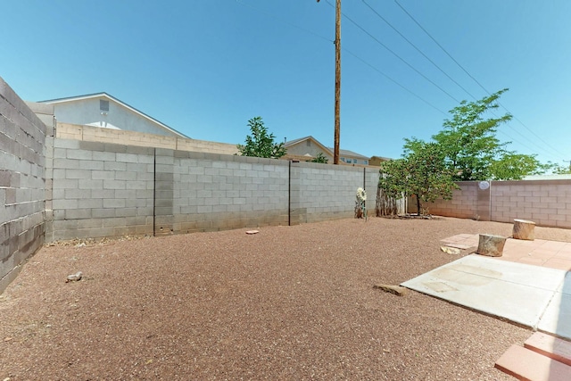10409 Red Robin Rd SW, Albuquerque, NM 87121 - fenced backyard featuring a patio area