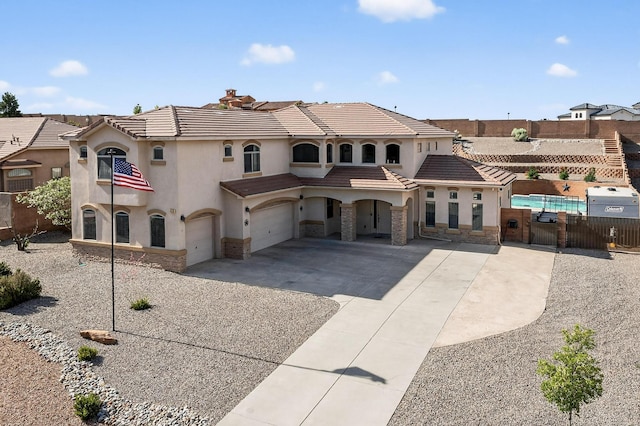 4420 Bentgrass Mdws NE, Rio Rancho, NM 87144 - view of front of house featuring a garage, a tile roof, stucco siding, driveway, and a gate