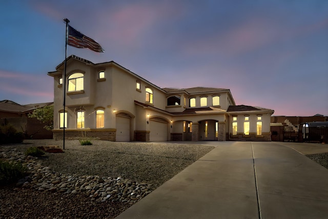 4420 Bentgrass Mdws NE, Rio Rancho, NM 87144 - mediterranean / spanish home with a garage, curved driveway, and stucco siding