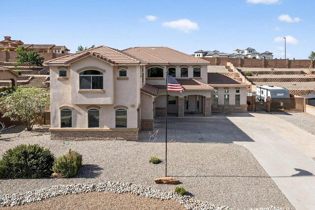 4420 Bentgrass Mdws NE, Rio Rancho, NM 87144 - view of front of home with a tiled roof, stucco siding, and driveway