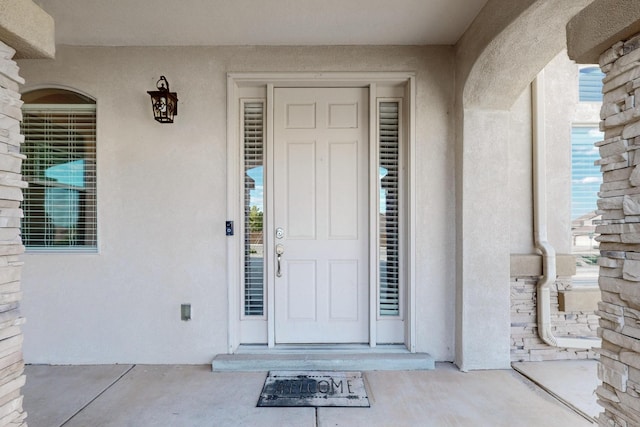 4420 Bentgrass Mdws NE, Rio Rancho, NM 87144 - doorway to property featuring stucco siding
