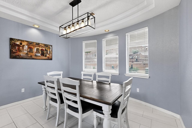 4420 Bentgrass Mdws NE, Rio Rancho, NM 87144 - dining space with a raised ceiling, light tile patterned flooring, a textured ceiling, and recessed lighting
