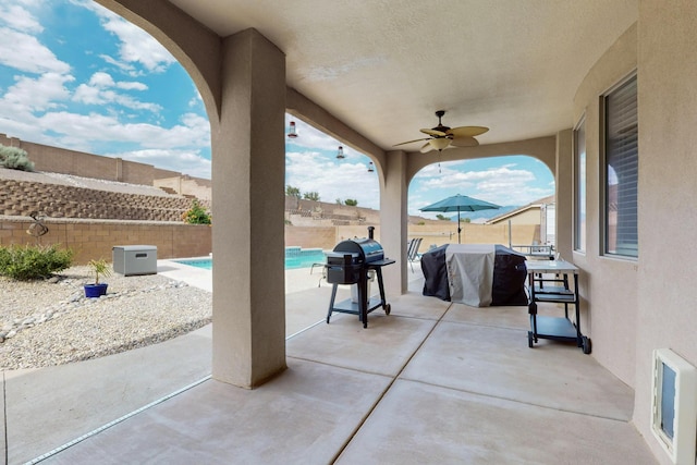 4420 Bentgrass Mdws NE, Rio Rancho, NM 87144 - fenced backyard featuring a grill, a ceiling fan, and a patio area