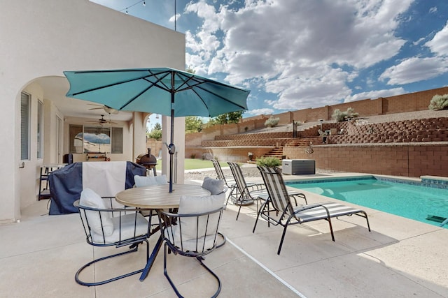 4420 Bentgrass Mdws NE, Rio Rancho, NM 87144 - view of pool featuring a fenced backyard, a patio area, a ceiling fan, and outdoor dining space