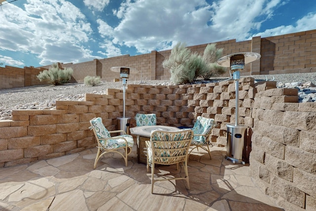 4420 Bentgrass Mdws NE, Rio Rancho, NM 87144 - fenced backyard with a patio area