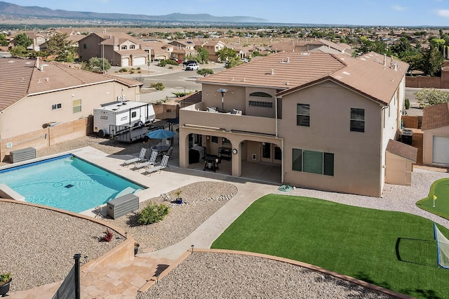 4420 Bentgrass Mdws NE, Rio Rancho, NM 87144 - view of pool featuring a residential view, a fenced backyard, a patio area, and a mountain view