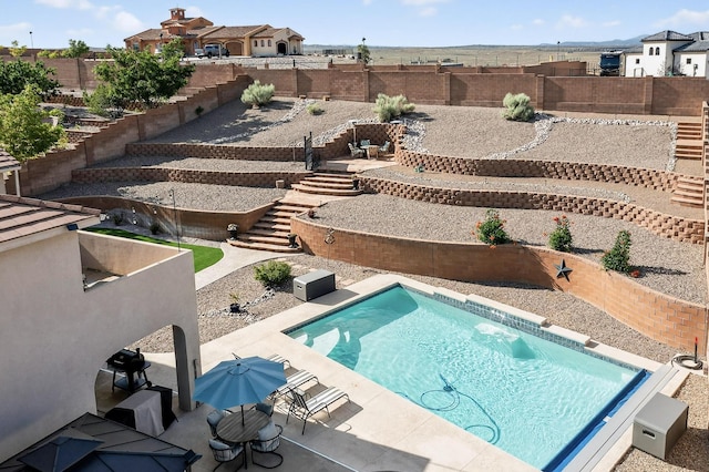 4420 Bentgrass Mdws NE, Rio Rancho, NM 87144 - view of swimming pool with stairs, a patio area, a fenced backyard, and a residential view