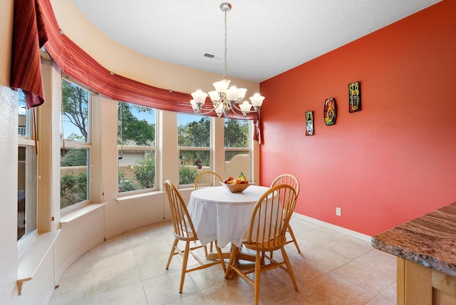 5808 Mariola Pl NE, Albuquerque, NM 87111 - dining area with a chandelier and light tile patterned floors