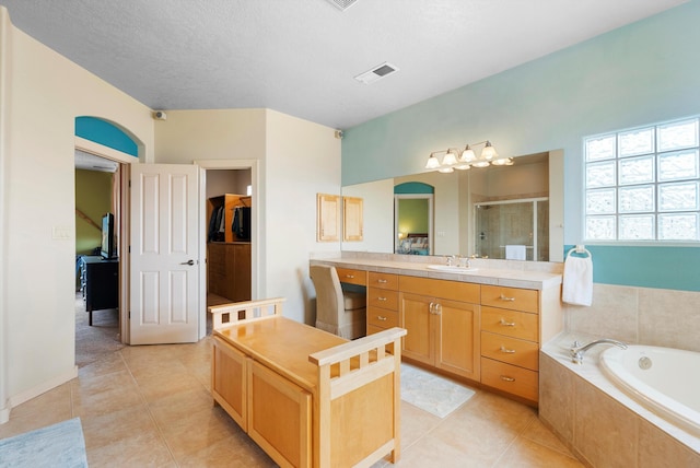 5808 Mariola Pl NE, Albuquerque, NM 87111 - full bathroom with a shower stall, a bath, vanity, and tile patterned floors