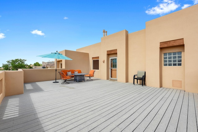 5808 Mariola Pl NE, Albuquerque, NM 87111 - wooden deck featuring a fire pit