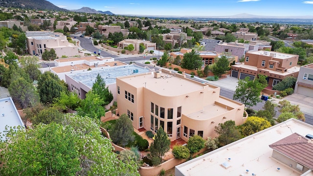 5808 Mariola Pl NE, Albuquerque, NM 87111 - aerial perspective of suburban area featuring a mountainous background
