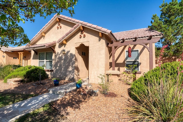 851 Vista Patron Dr, Bernalillo, NM 87004 - view of front of property with stucco siding and a tiled roof