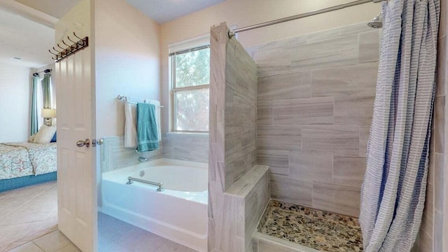 851 Vista Patron Dr, Bernalillo, NM 87004 - ensuite bathroom featuring a bath, a tile shower, and tile patterned floors